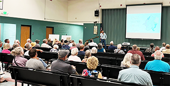 Dr. Greg Pohll, TMWA's Principal Hydrogeology Modeler, provides an overview of Spanish Springs Valley hydrogeology at the July 10 open house held at Alyce Taylor Elementary School.